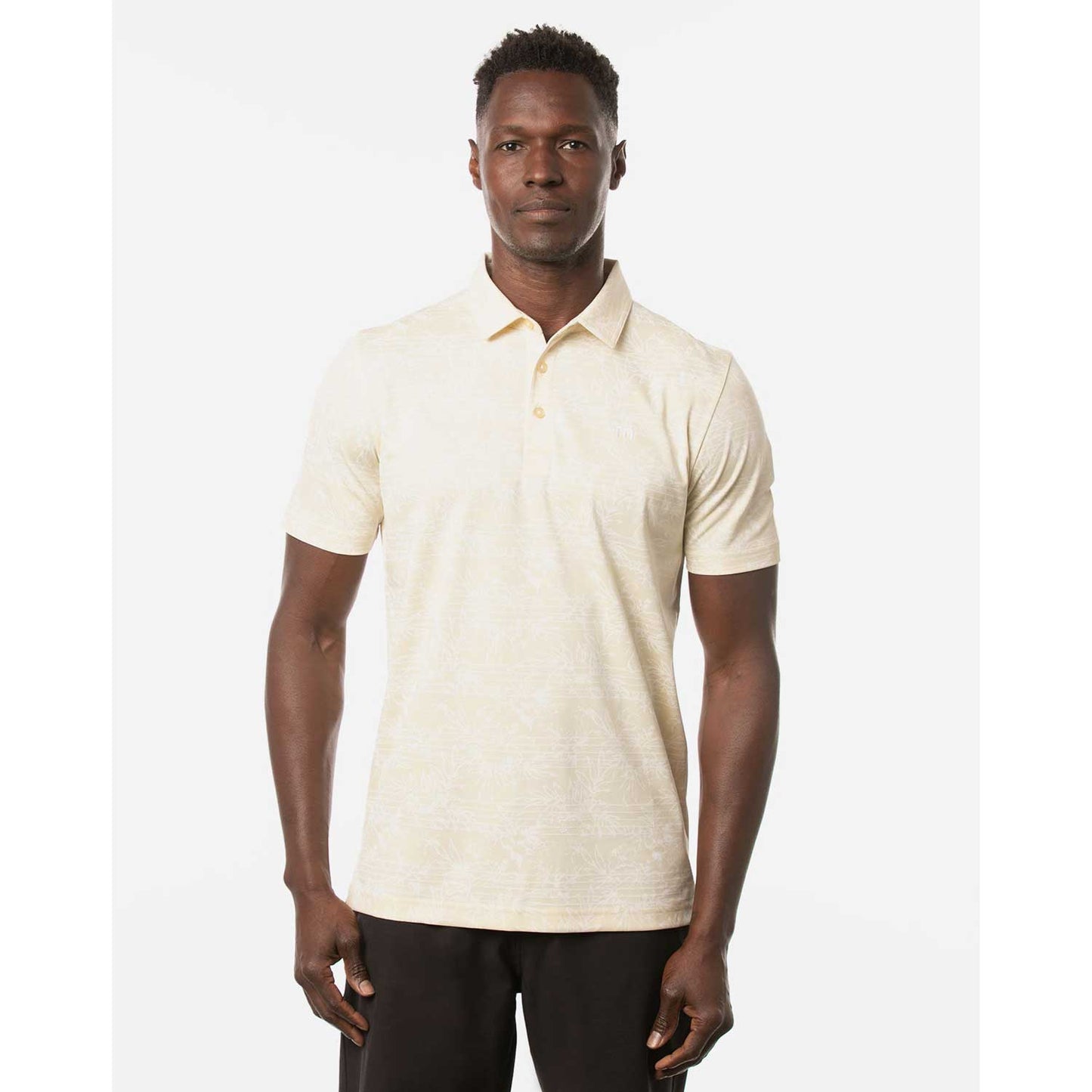 Man wearing a Travis Mathew On Porpoise Men's Yellow Golf Polo Shirt