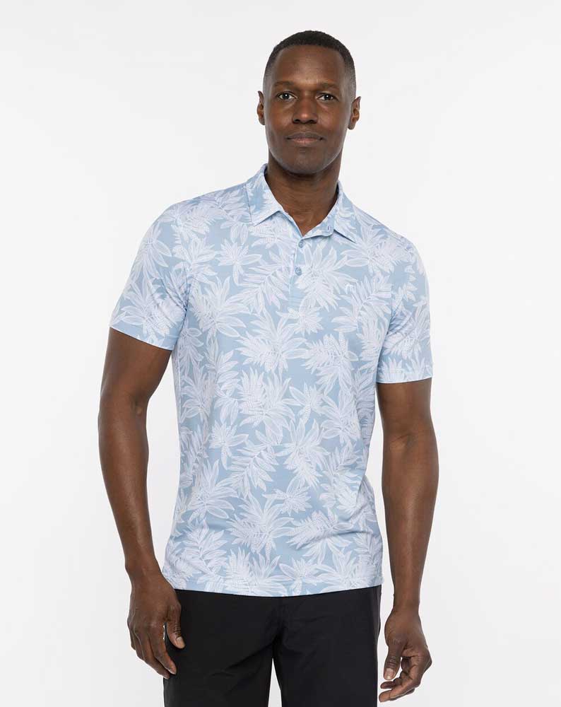 Man wearing a Travis Mathew Sea Journey Men's Polo Shirt in Ash Blue