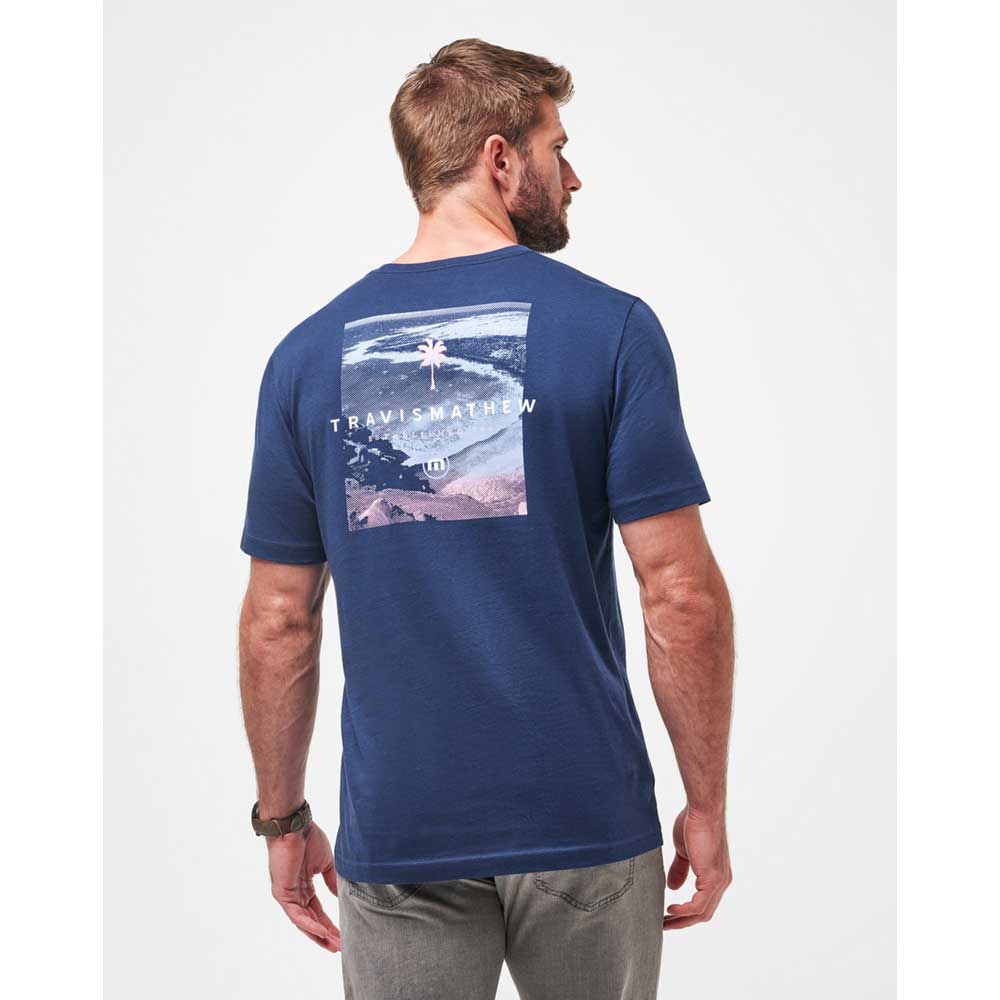 Man wearing a Travis Mathew On the Docks Men's T-Shirt in Total Eclipse Blue
