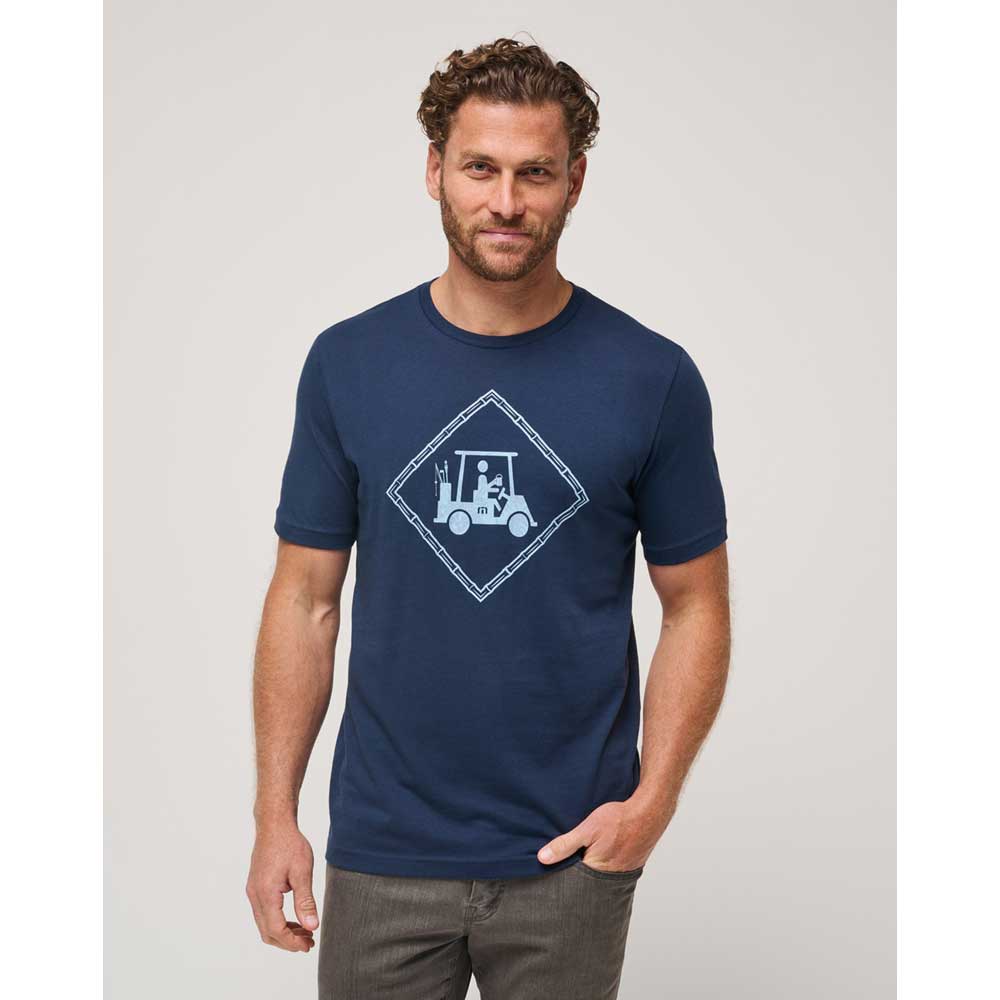Man wearing a Travis Mathew Plot Twist Men's T-Shirt - Navy Total Eclipse