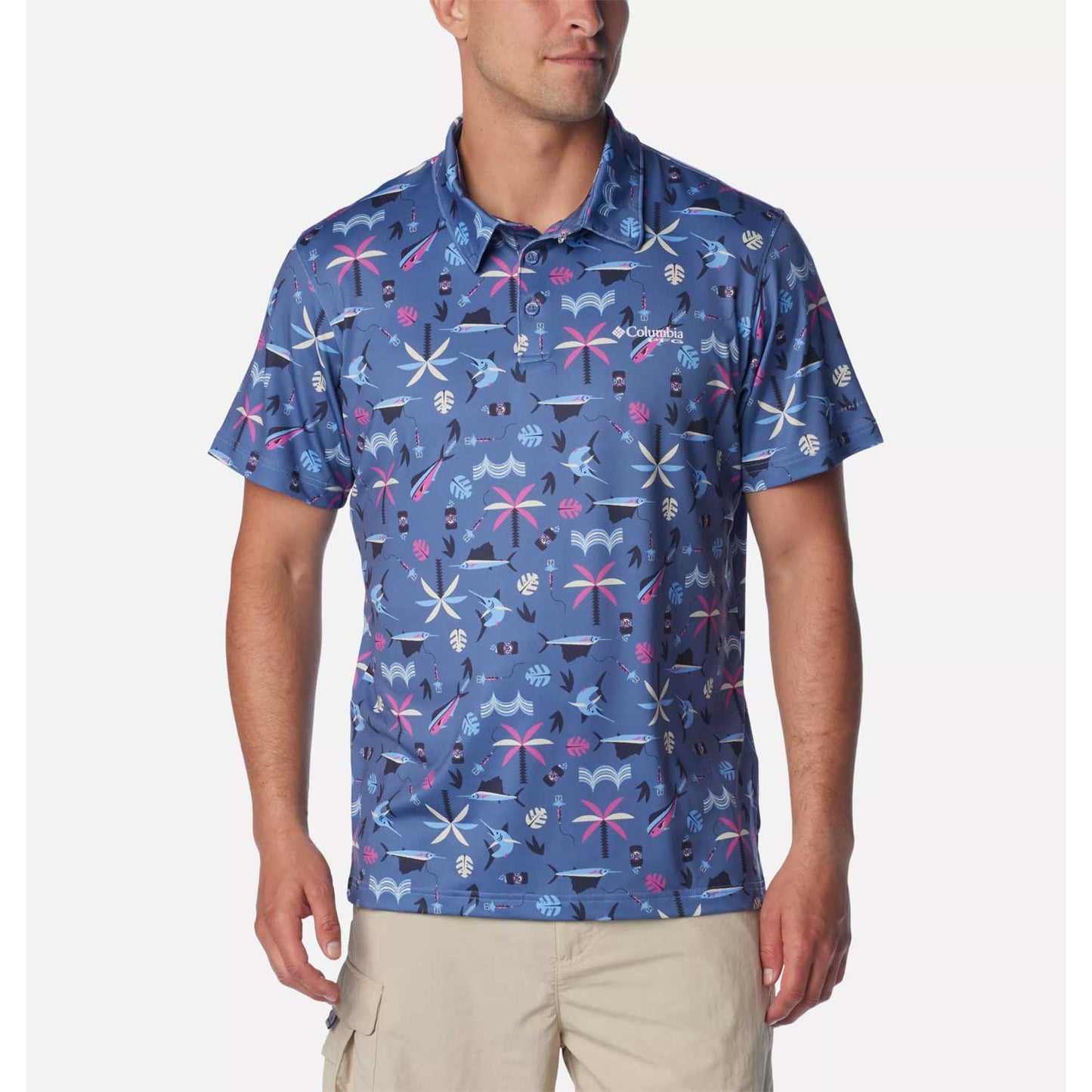 Man wearing a blue Columbia Sportswear Men's PFG Super Slack Tide Stretch Polo with fishing graphics.
