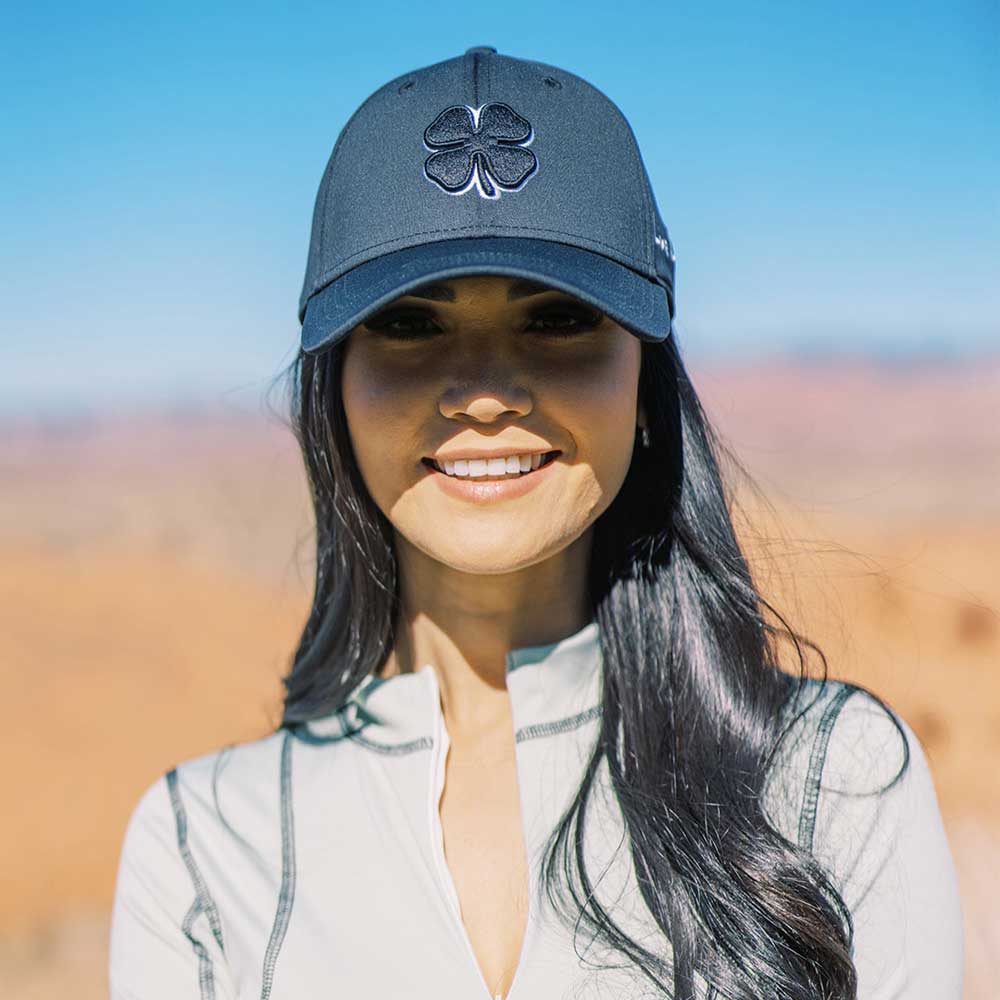 Girl wearing a Black Clover Premium Clover Hat 2