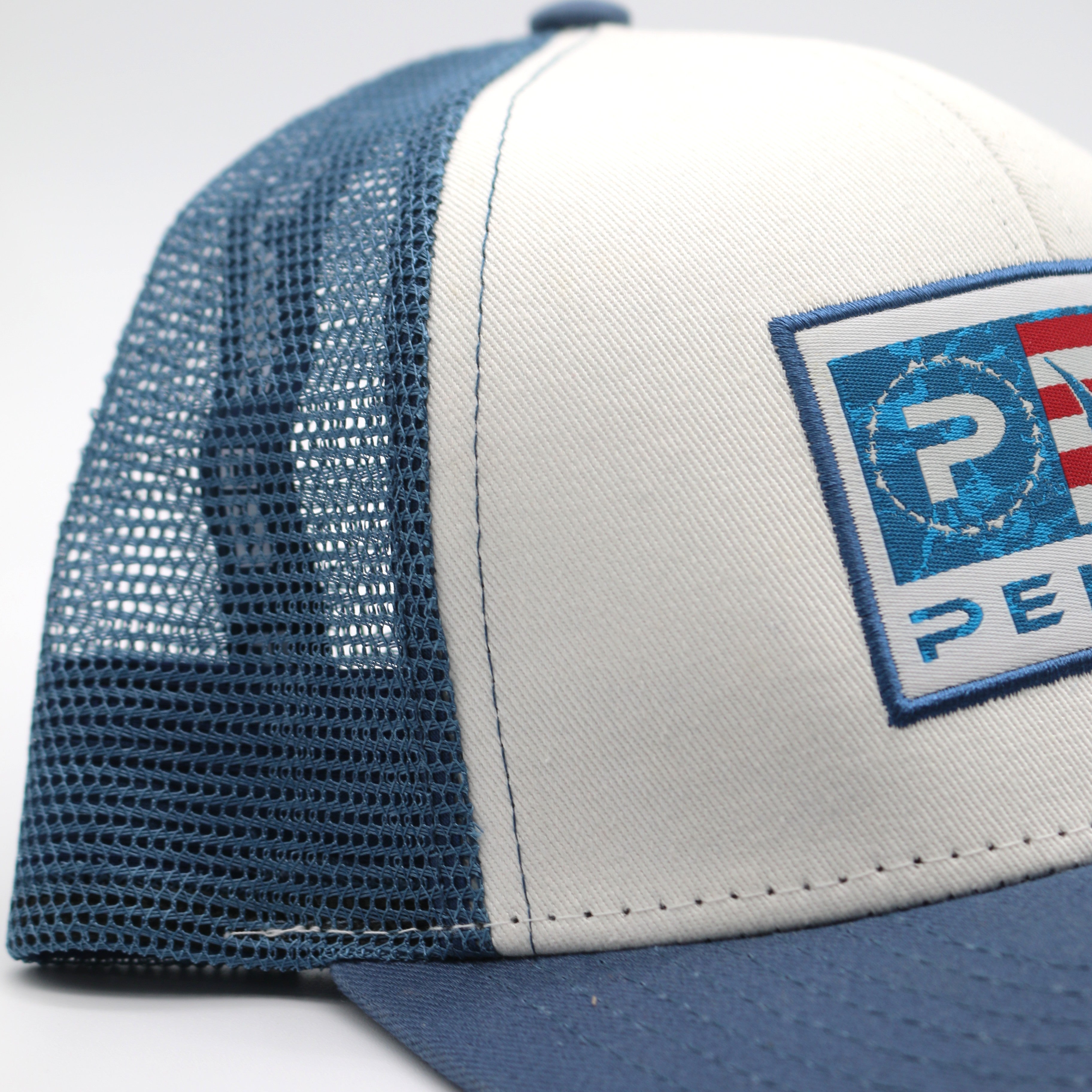 Pelagic The Pursuit Trucker Hat - Icon Americamo